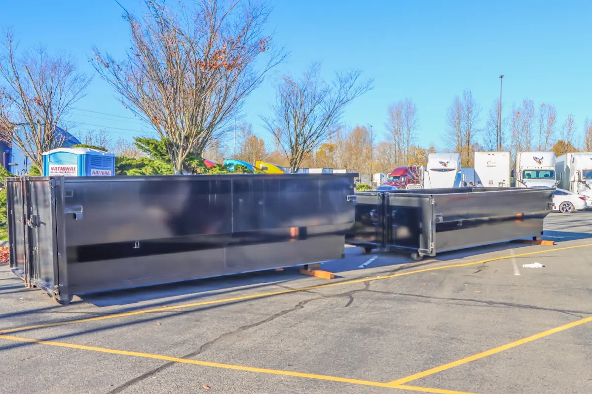 Professional dumpster rental service with roll-off container on residential driveway in Cape Canaveral